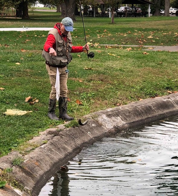Angler catches trout from Liberty Park Lake in Sedalia.