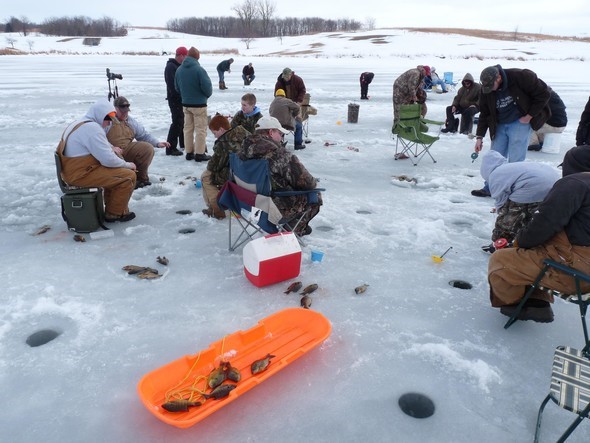 People gather to ice fish