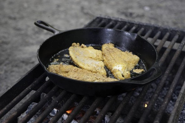 Fried fish filets in cast iron skillet