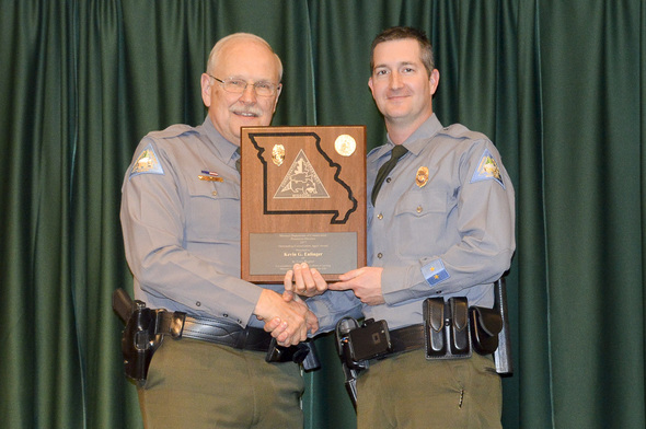 Lincoln County Conservation Agent Kevin Eulinger receiving an award.