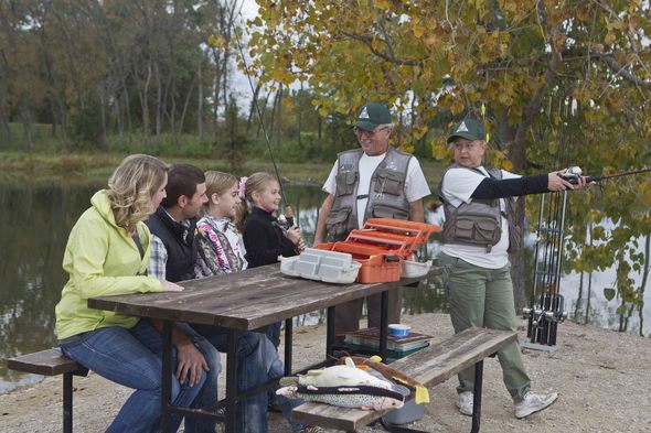 A family learns about fishing from two experienced anglers.