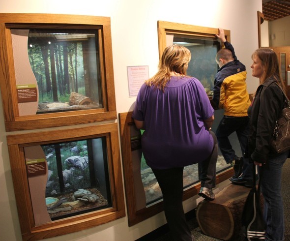 A family views wildlife at Burr Oak Woods Nature Center.