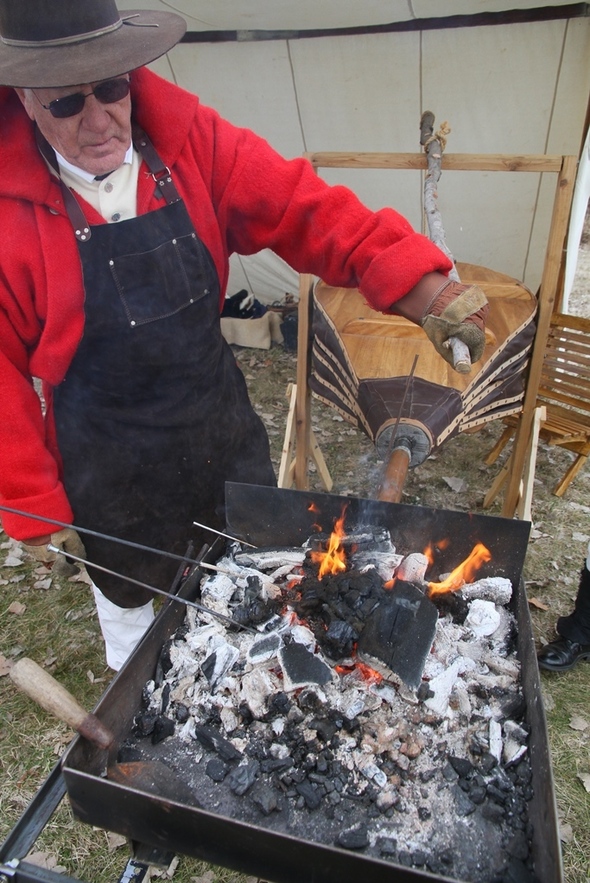 A man working with fire.