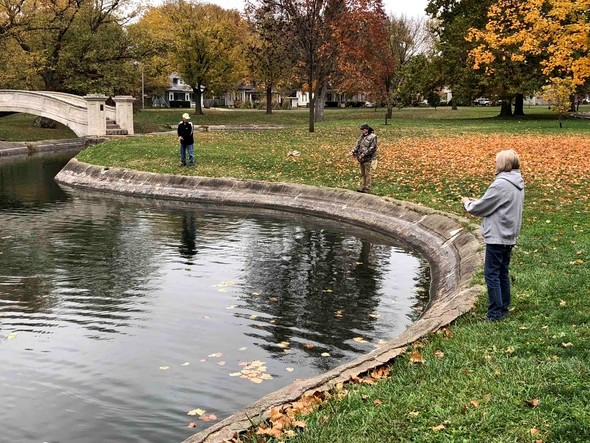 Several people fish from Liberty Park Pond in Sedalia.