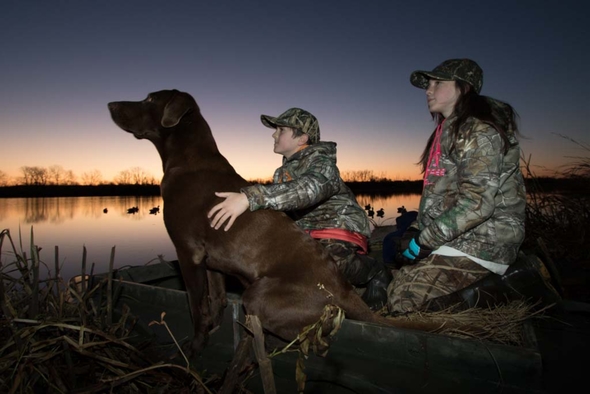 Youth waterfowl hunting with dog