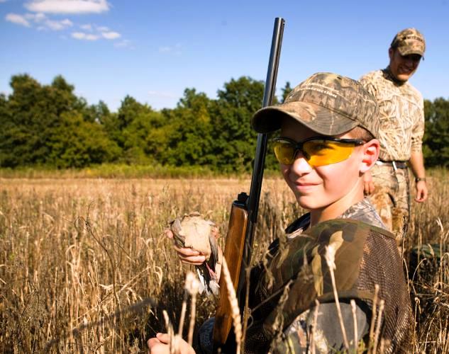 young dove hunter in field