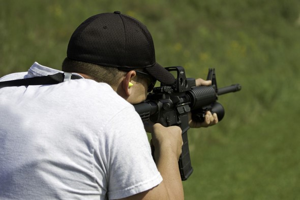 man shooting AR-15 style rifle