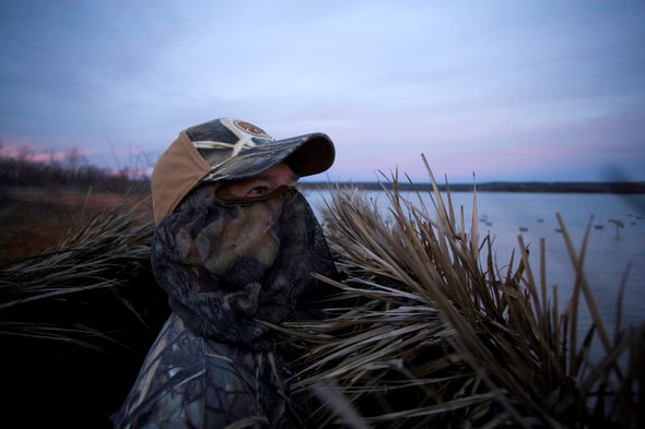 waterfowl hunter in blind
