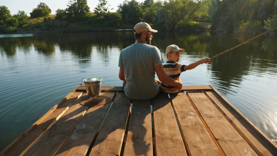 Dad and son on fishing dock