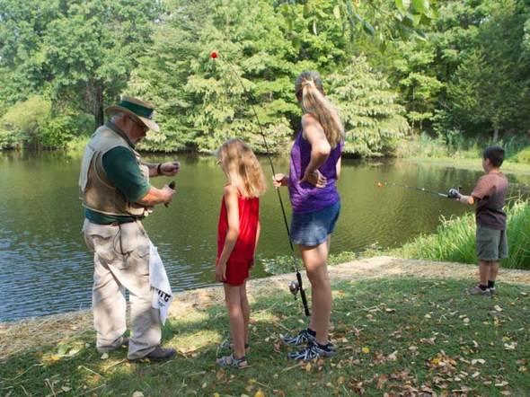 Kids fishing with an MDC instructor.