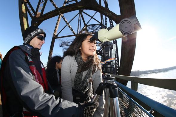 People looking through telescope at Eagle Days at Old Chain of Rocks Bridge 