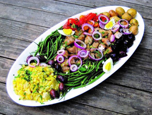 A plate of food, including green beans, corn, eggs, meat, and potatoes, prepared during an MDC Field to Fork event.