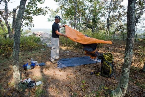 man setting up campsite