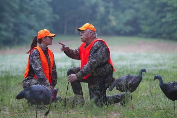 mentor teaching new turkey hunter