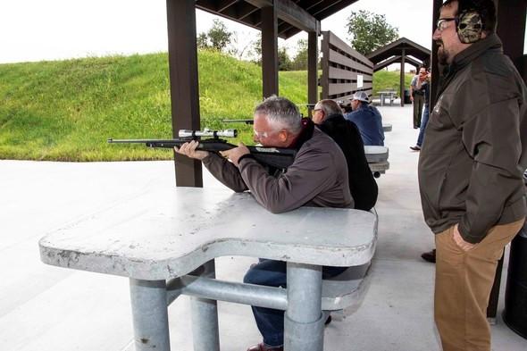 Missouri State Rep. Brad Pollitt of Sedalia was among those taking first shots at the new target range, as MDC Outreach and Education Chief Kyle Lairmore looked on. Missouri State Rep. Glen Kolkmeyer of Odessa is to their right on the firing line.
