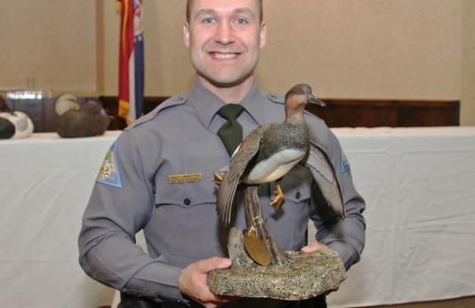 Nick Bommarito holds Missouri Flyway Waterfowl Officer of the Year award