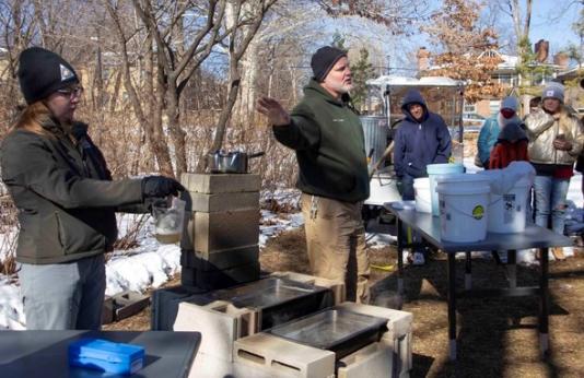 MDC staff hold a sap to syrup program