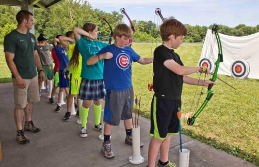 Youth practice archery