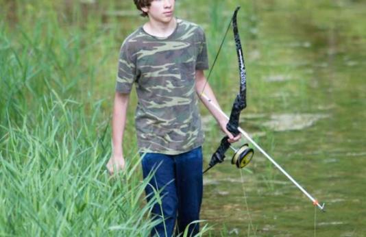 Young Man Bowfishing