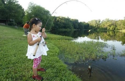 Little girl fishing.