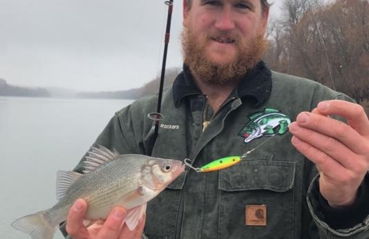 Bryant Rackers shows off the first state record white perch.