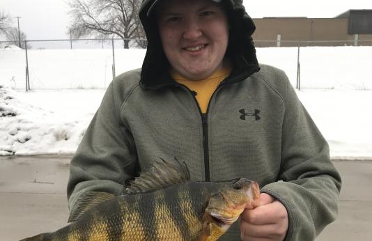 Tyler Halley shows off his state-record yellow perch.