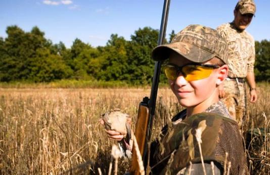 young dove hunter in field