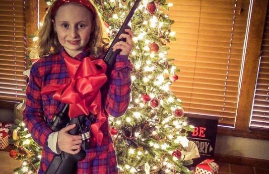 girl with firearm for the holidays