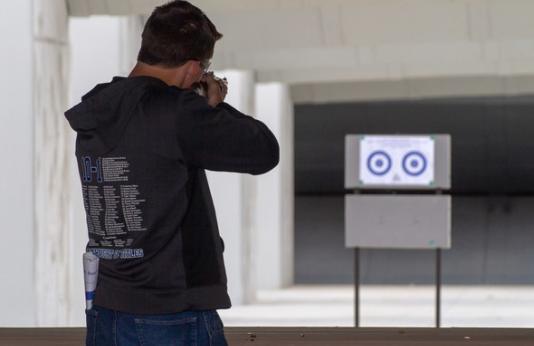 man shooting rifle at Busch Shooting Range