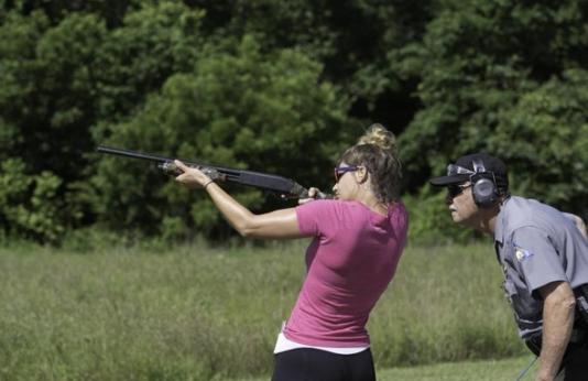 woman shooting shotgun